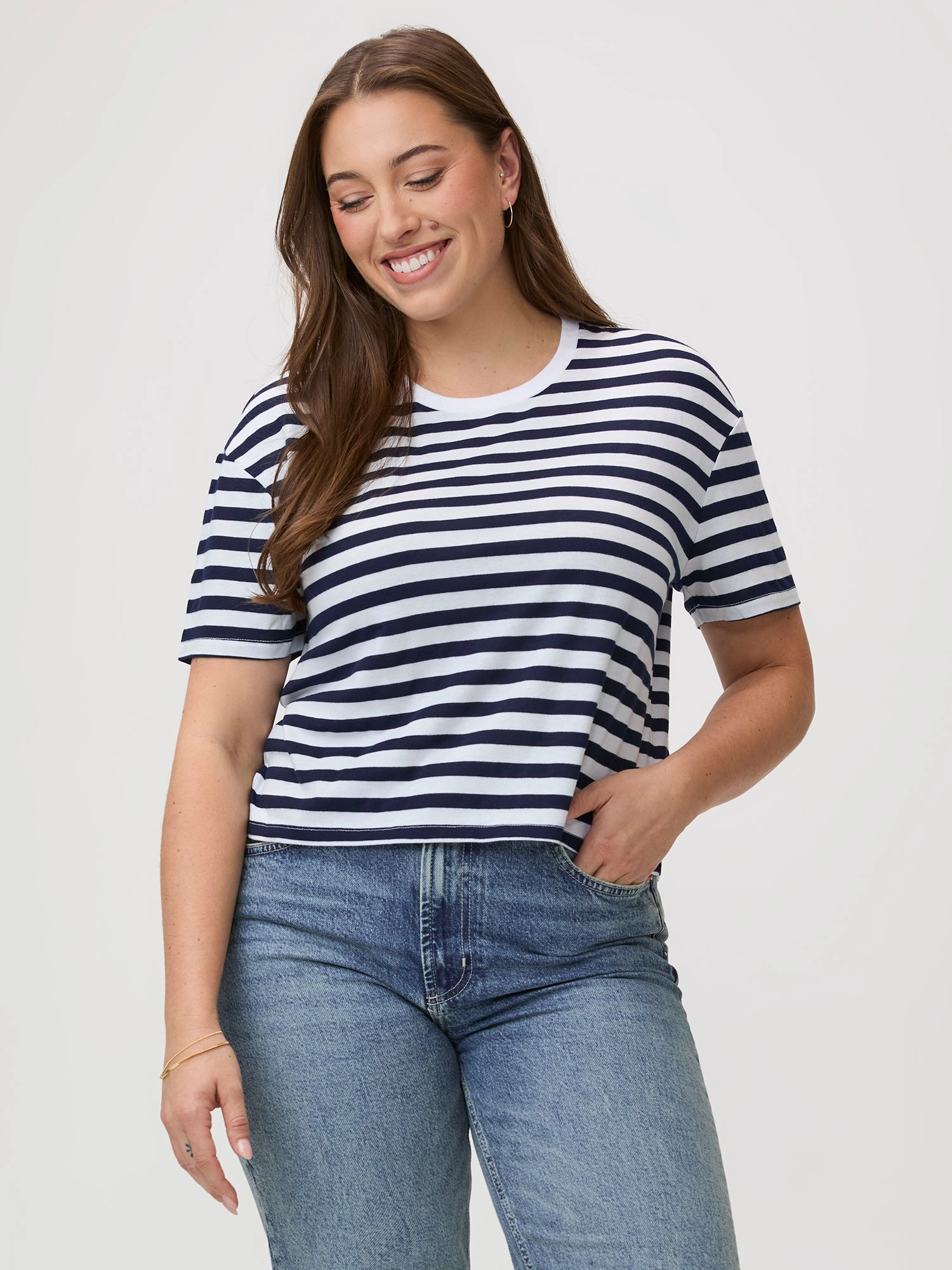 Model wearing a navy and white crew tee