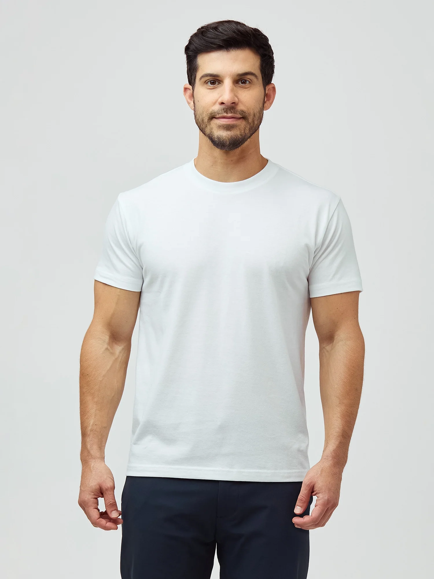Joey in a white short-length crew tee